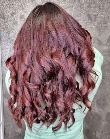 Red and copper curls coloured at Indigo
