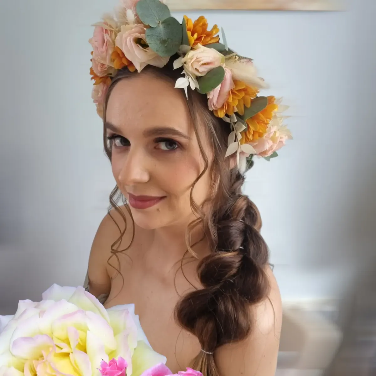 Bridal braid finished with a fresh flower crown, styled at Indigo